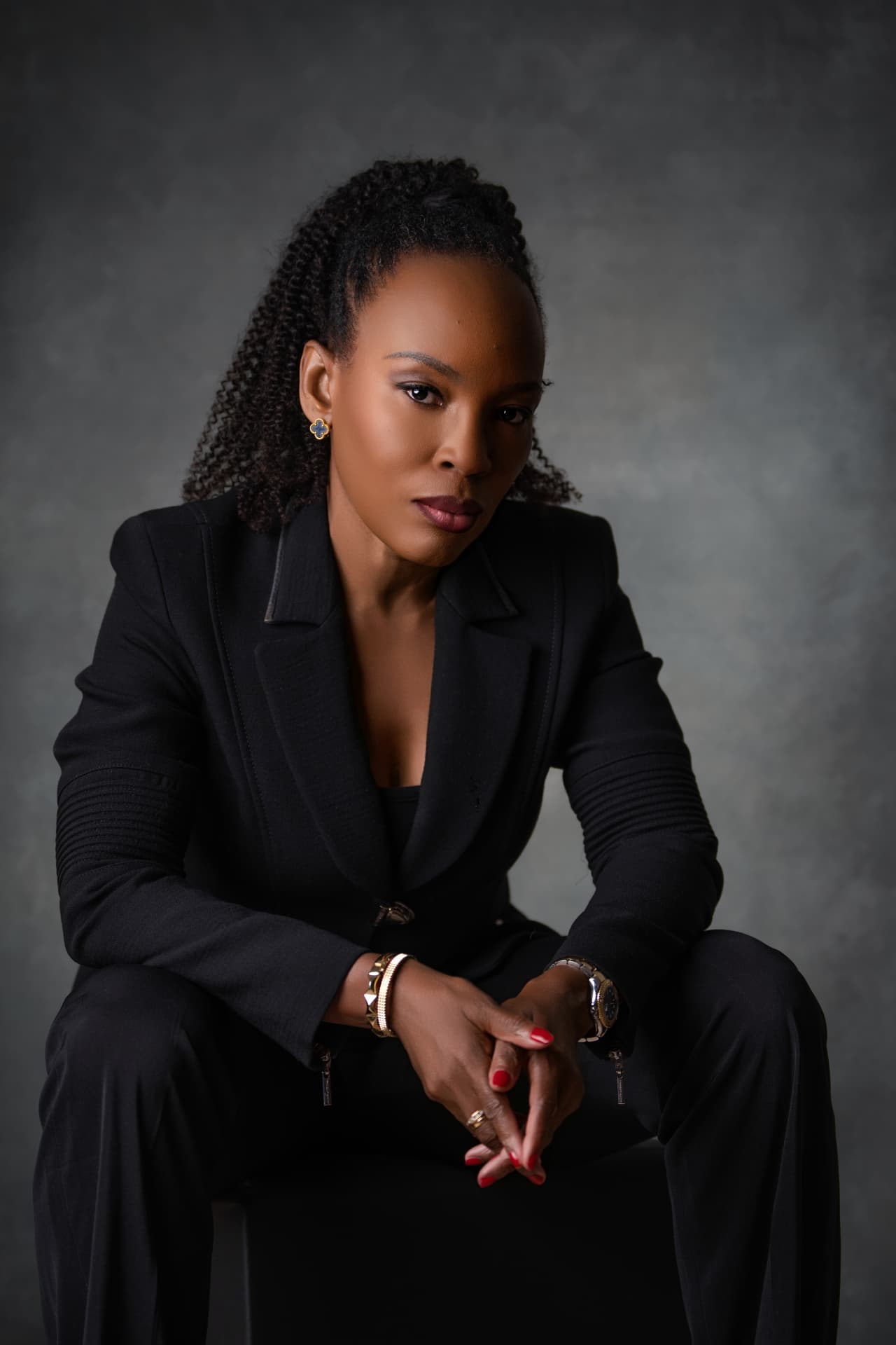 Maryann Selfe, seated portrait in a dark suit